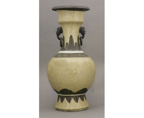 An unusual stoneware Vase,probably mid 18th century, the globular body, foot and neck under a ge toffee glaze between iron ox