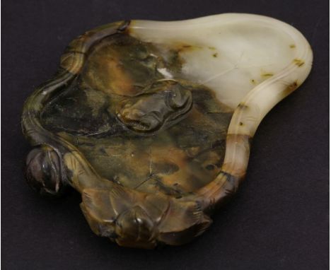 A jade Brush Lick,probably Republic, carved in the form of lily pad, flower and seed pod the underside with stems, the top ce