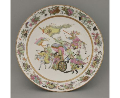 An unusual famille rose Dish,Republic period (1912-1947), the centre painted with a lady in a wheeled carriage pushed by atte