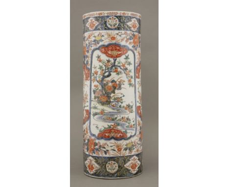 An Imari Stick Stand,late 19th century, typically enamelled and gilt, with panels of landscapes, flowers and ho-o, restored a