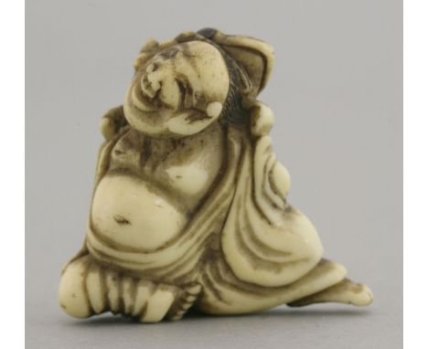 A stag antler Netsuke,mid 19th century, of Gama Sennin, a toad on his shoulder, with inset horn eyes, 4cm
