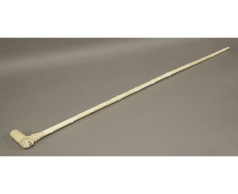 A Rajasthan ivory walking stick, mid 19th century, the handle with lion mask, the stick with raised nipples and in eight segm