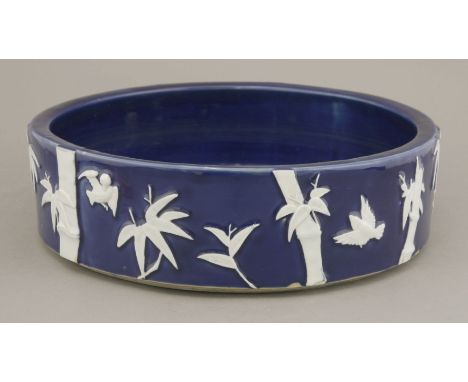 An interesting 'Aesthetic Movement' Basin,c.1870, moulded on the low cylindrical exterior with white bamboo and birds, the in