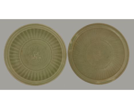 A Longquan deep basin, the fluted sides enclosing an impressed prunus, channelled rim, and another similarly decorated, one c