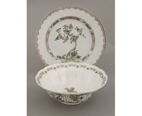 A superbly enamelled Bowl,Kangxi (1662-1722), of fluted deep form, the underside painted with panels of various flowers growi