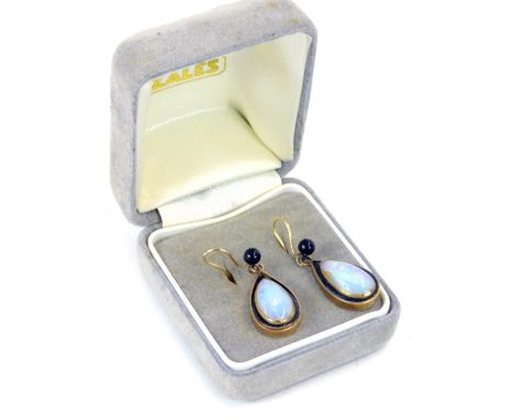 A pair of Moonstone and black enamel drop earrings, each formed as a tear drop, yellow metal backs, unmarked, 4.9g all in.