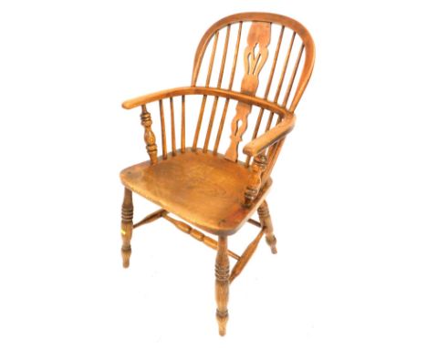 A 19thC beech oak and elm Windsor chair, with a pierced splat back, solid saddle seat raised on turned legs, united by an H f