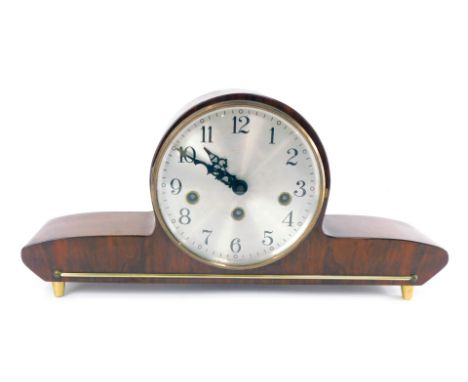 A 1950's German walnut cased mantel clock, circular silvered dial bearing Arabic numerals, eight day movement with Westminste