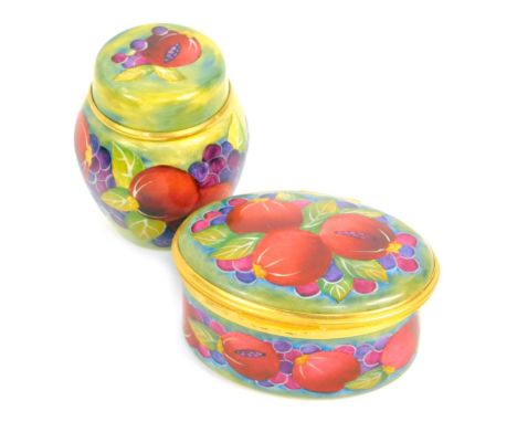 A Moorcroft Pottery miniature enamel ginger jar and cover decorated in the Pomegranate pattern, 9cm high, together with an en