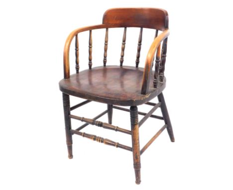 A late 19thC oak Captain's chair, with a shaped bobbin turned back, two banded base with turned legs.
