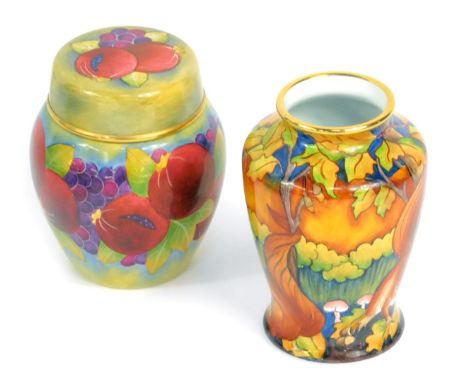 A Moorcroft Pottery miniature enamel ginger jar and cover decorated in the Pomegranate pattern, 7cm high, and a further minia