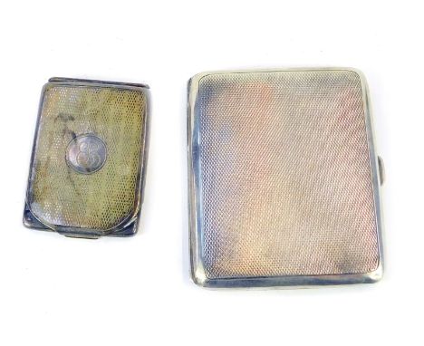 A George V silver engine turned cigarette case, Birmingham 1932, and associated silver match sleeve bearing initials E L to t