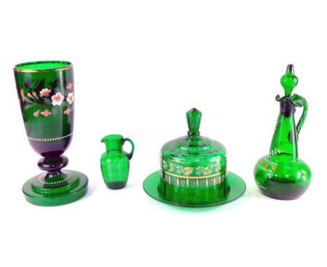 A group of late 19thC green glass, comprising a vase enamel decorated with wild roses, on a knopped stem and stepped circular