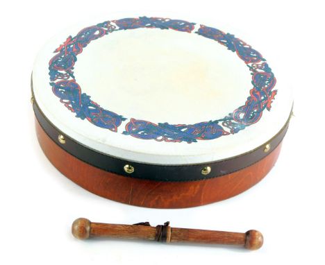 An Irish bentwood and hide bound bodhran, decorated to the top with a Celtic design, with beater, 31cm wide. 