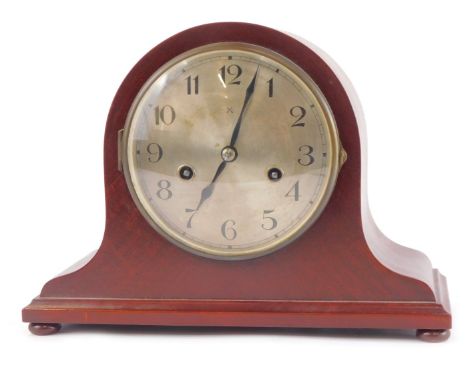 An early 20thC Hamburg American Clock Company mahogany cased mantel clock, circular silver dial bearing Arabic numerals, eigh