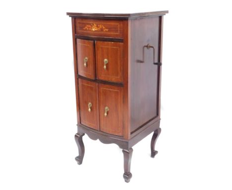 An Edwardian mahogany gramophone cabinet, with inset record player, above arrangement of two cupboards, on out splayed feet, 