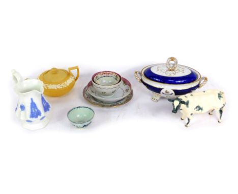 A group of 19thC and later ceramics, comprising New Hall saucer and tea bowl and saucer, a Beswick style cow, a blue and whit