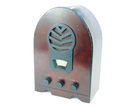 An Art Deco style radio, in red stained lancet shape pine casing, 37cm high. 