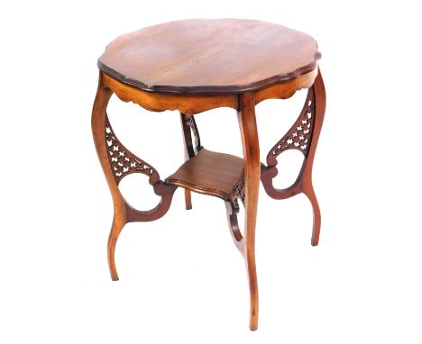 A Victorian mahogany window table, with a fluted top, on lowered shelf with fret moulded supports, on out splayed legs, 70cm 