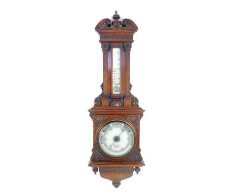 A Victorian  Benetfink and Co of Cheapside London mahogany cased barometer, with heavily carved case and a mercury spiral dia