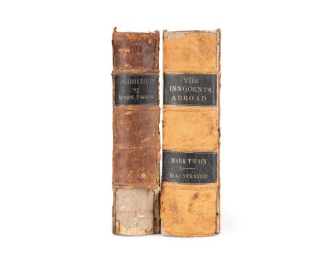 Two Mark Twain books bound in leather: Roughing It by Mark Twain. Published 1872 by American Publishing Company. First editio