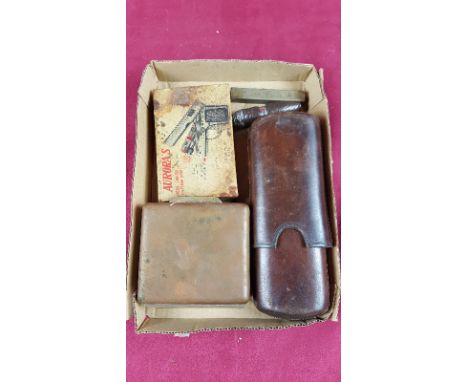 A novelty lighter in the form of a gun; a leather cigar case; a brass cigar box etc.