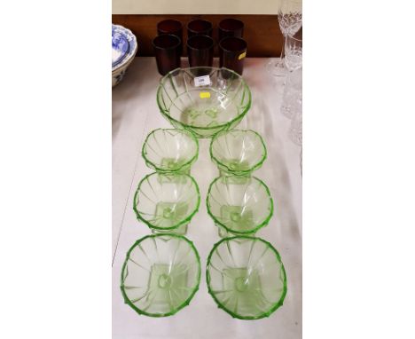 An Art Deco style green glass dessert service and a set of six ruby glass drinking glasses 