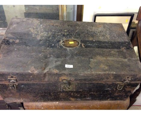 A tin travelling trunk