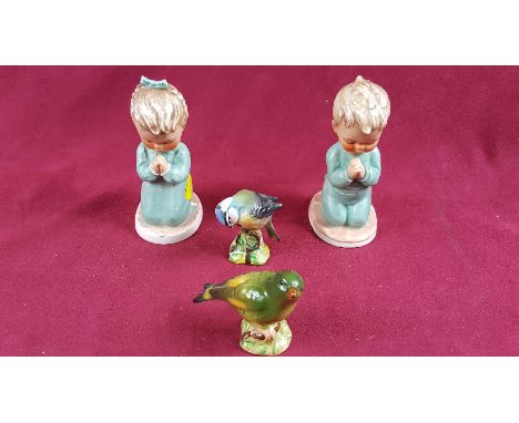 A pair of Goebel figures and two Beswick birds