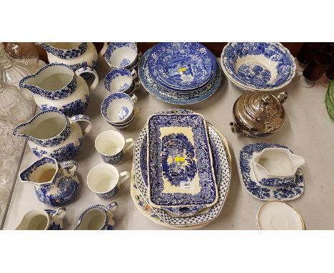 A set of three Greene and Co. 'Old Willow' patterned jugs; Copeland Spode 'Italian' patterned teacups and various other blue 