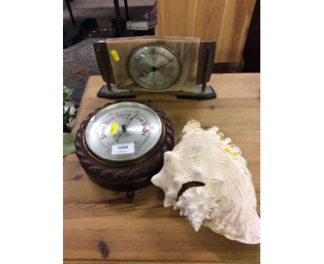 A George Wilson & Co. oak cased barometer with rope twist border; an Art Deco style mantel clock; and a shell