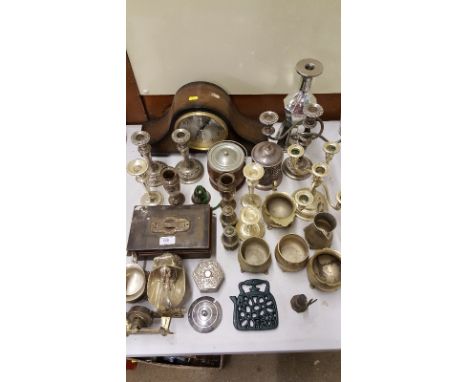 A quantity of various silver plated ware to include candelabra; a sugar scuttle; jugs; a mantel clock etc.