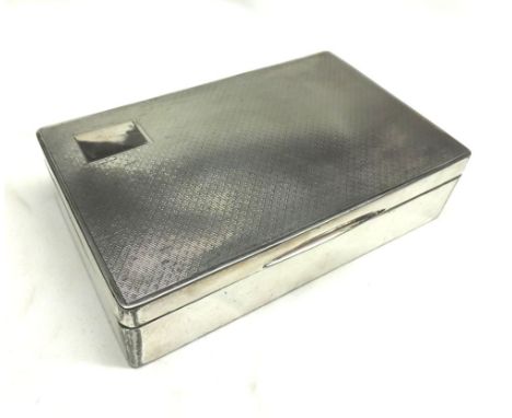 A Silver Plated Cigarette Case of rectangular form with engine-turned decoration and wood lined interior, 5 =  wide 