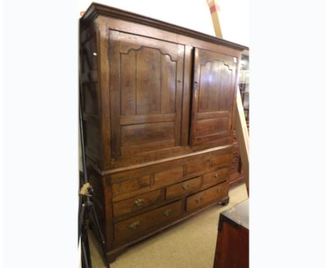 An 18th Century Oak Housekeeper s Cupboard, moulded cornice over two panelled doors enclosing an interior fitted with pegs, t