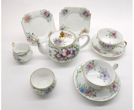 Ainslie Tea Service, with floral painted decoration, signed  Susan Place 1934  , comprising Tea Pot, Cream Jug, Sugar Basin, 