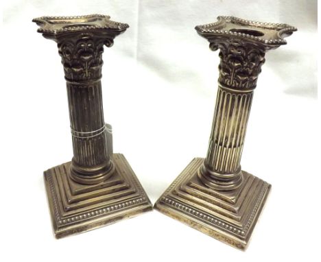 A pair of George V Silver Candlesticks, Corinthian column form, raised on stepped square bases, London 1910, 6 high&nbsp;
Con