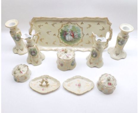 An early 20th Century Ceramic Dressing Table Set comprising: Double-Handled Tray, three Covered Jars, two small Ewers, pair o