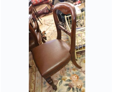 A set of six Victorian Mahogany Balloon Back Dining Chairs, with brown upholstered seats, raised on heavy turned front legs w
