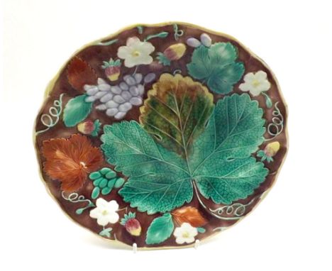 A Wedgwood Majolica style Plate decorated with leaves and foliage, 8" diameter
&nbsp;
Lot 182 - Slight underside foot surface