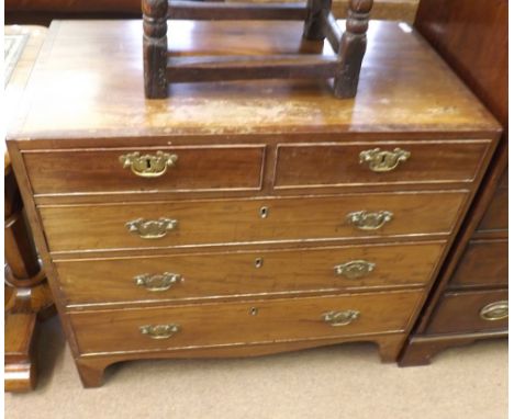 Small early 19th Century Mahogany chest of two short and three long drawers, fitted with Brass swan neck handles, raised on b