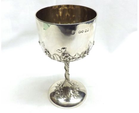 A good quality Victorian Silver Goblet, the body decorated with trailing flowers, raised on a tree trunk effect stem and spre