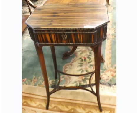 19th Century Coromandel sewing table of octagonal form, the hinged lid opening to reveal an interior with sub-divided section