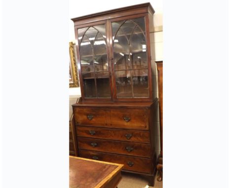 An early 19th Century Mahogany Secretaire Bookcase Cabinet, moulded cornice over a glazed top enclosing fitted adjustable she