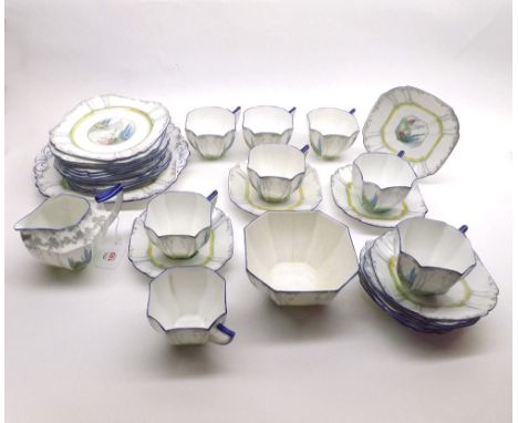 A quantity of Shelley Tea Ware of octagonal form, Reg No 723404, comprising nine Cups with Saucers, Side Plates and additiona