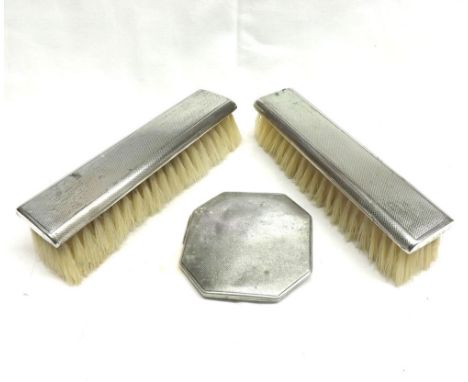 A Mixed Lot comprising: two early 20th Century Silver Backed Dressing Table Brushes and a further Octagonal Silver Powder Com