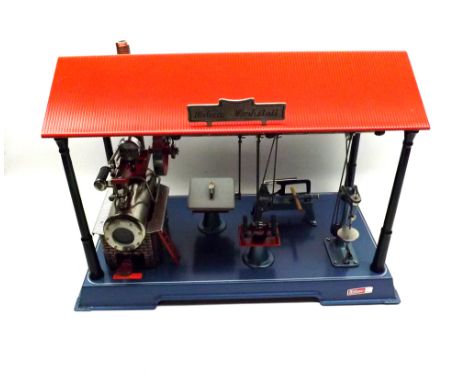 A Wilesco  Werkstatt  (workstation), fitted with static traction engine and various implements including grinder, lathes etc,