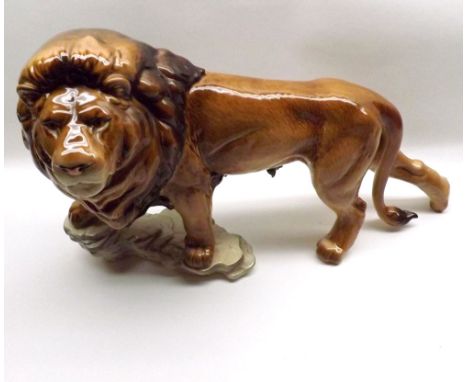 A large Goebel Model Lion on rocky plinth, No 3601926 to base, 17  long  