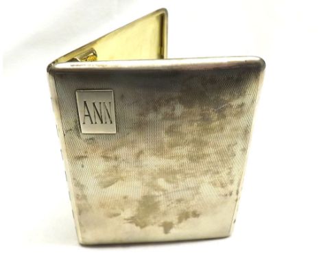 A George VI Silver Cigarette Case of rectangular hinged form, the body decorated with engine-turned detail, gilt-lined interi
