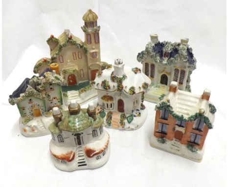 A collection of six various Staffordshire Cottages including a moneybox and two pastille burners, all painted in colours&nbsp