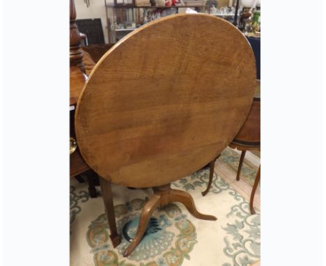 19th Century Oak snap top Table, the round top to a turned column and tripod base, 31  diameter  